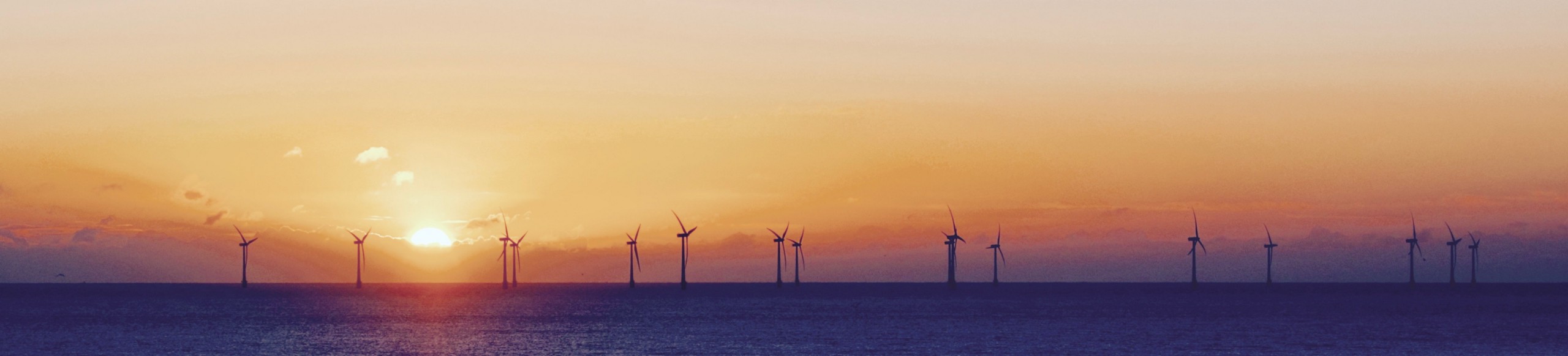 wind turbines at the sunset