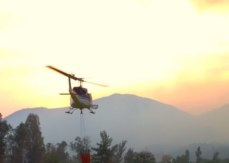 helicopter flying in the forest in Chile