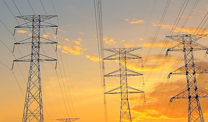 medium voltage towers sunset