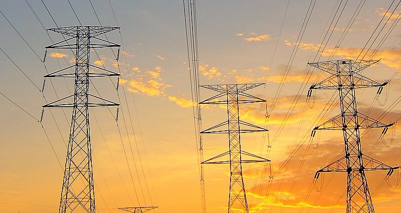 medium voltage towers sunset