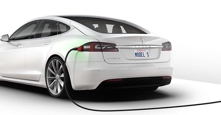 charging a white Tesla Car, white background