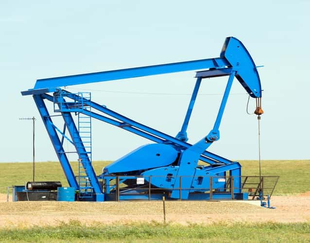 oil blue derrick pump in a field