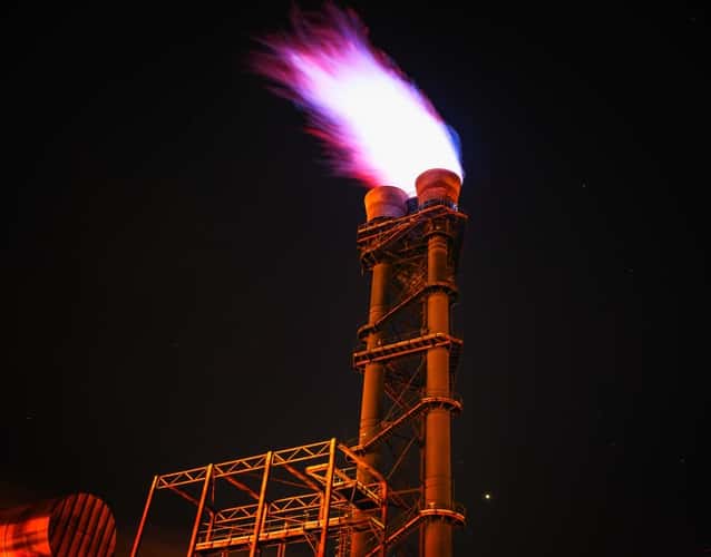 refinery flare at night