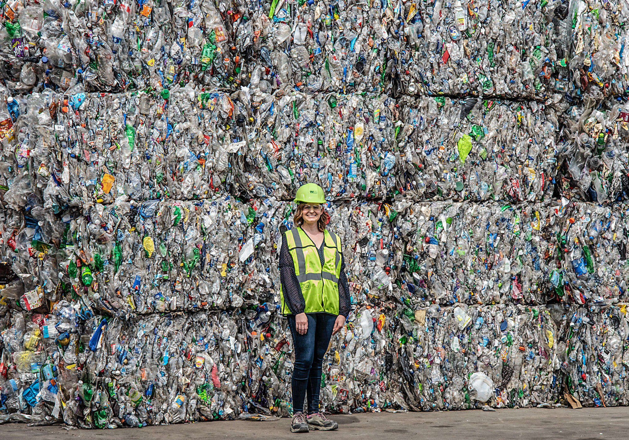 Erika Deyarmin-Young, spokesperson for Waste Management, stands with bales of plastic garbage at Greenstar Recycling on Neville Island in the Ohio river, around 20 miles south of Shell’s cracker plant. CREDIT: Teake Zuidema/Nexus Media News