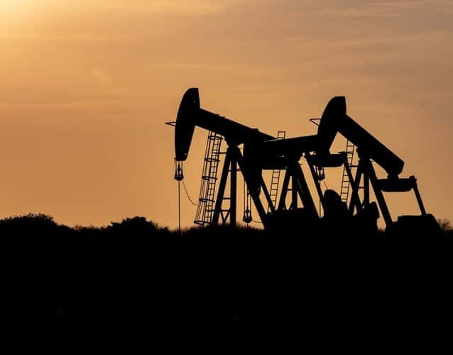 oil derrick pump silhouette photo taken during sunset