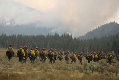Black Mountain Hotshots hiking into the Slink Fire in California.Credit: USDA photo by Charity Parks via Flickr