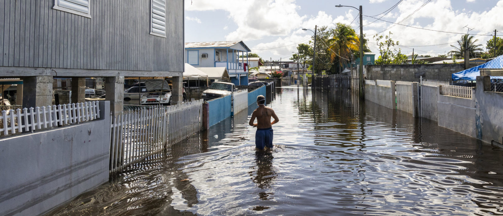 A man walks through a flooded street to get to his home in Juana Matos, Cataño, Puerto Rico. Credit: FEMA/Yuisa Ríos