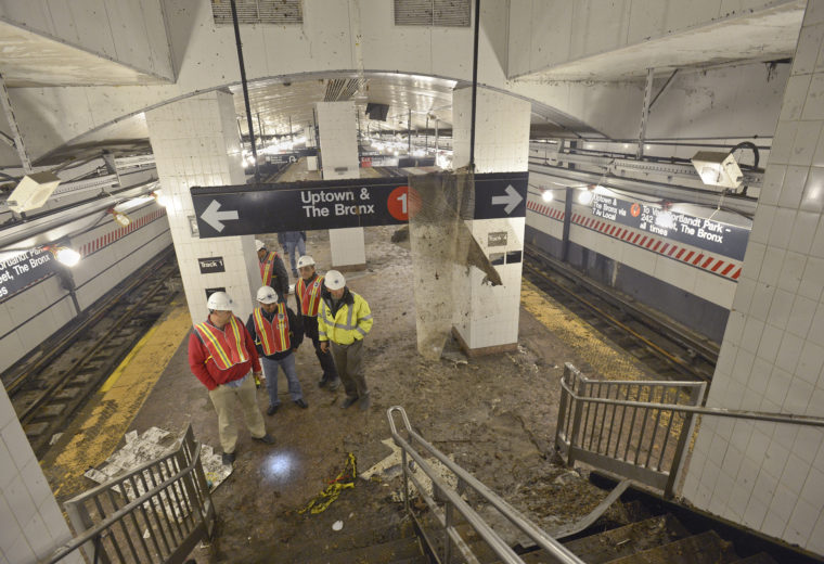 Workers examine damage to New York's South Ferry subway station following Hurricane Sandy's storm surge. Credit: Metropolitan Transportation Authority / Patrick Cashin via Flickr