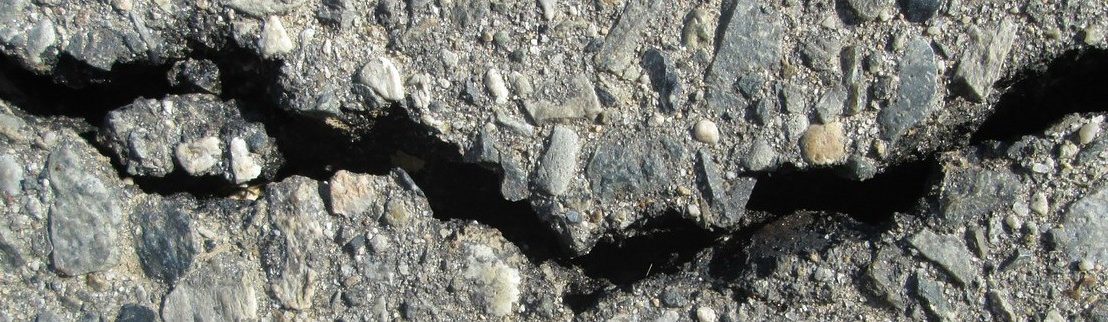 A crack in a road. Source: Pixabay