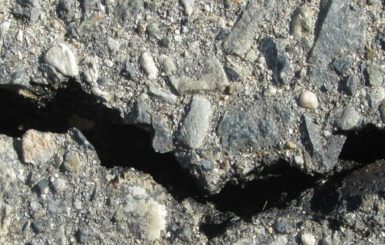 A crack in a road. Source: Pixabay