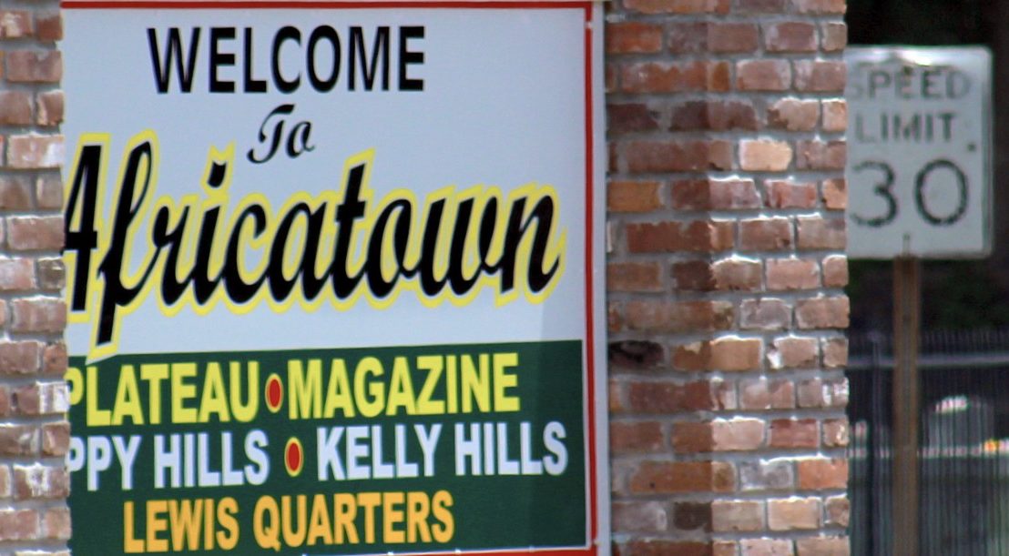 A sign welcoming visitors to Africatown. Source: Amy Walker