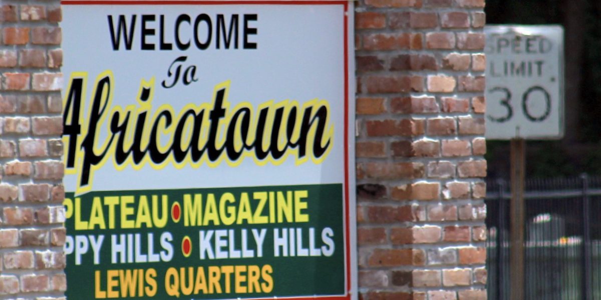 A sign welcoming visitors to Africatown. Source: Amy Walker