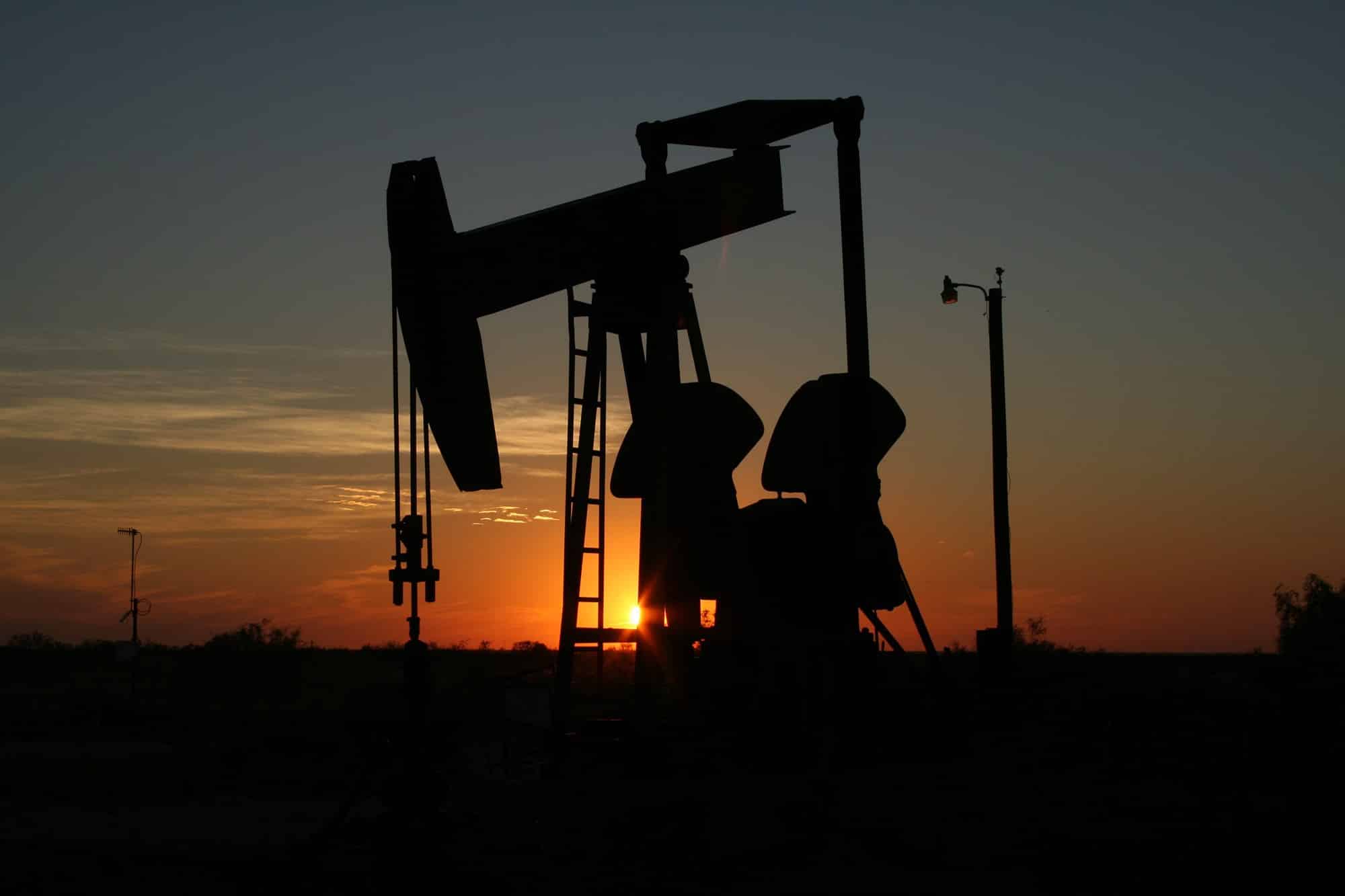 oil rig silhouette with sunset background